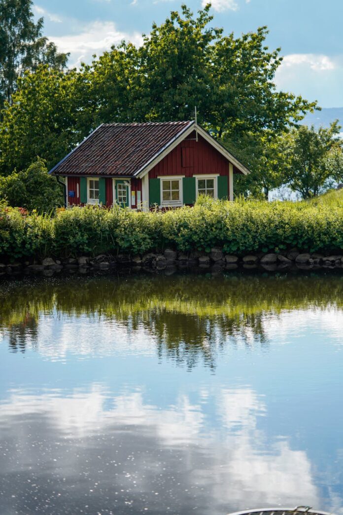pexels-photo-25752963 wooden cabin on island on lake