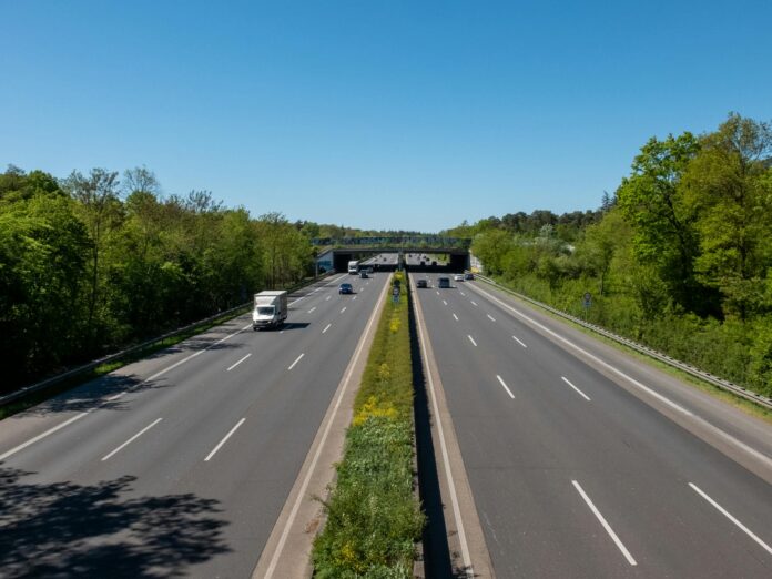 pexels-photo-37365923 wide open highway with sparse traffic in summer
