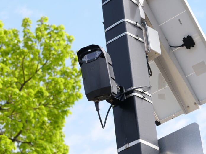 pexels-photo-37549154 solar powered surveillance camera on street pole